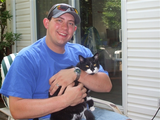 Matt holding Matt, the neighbor's cat.