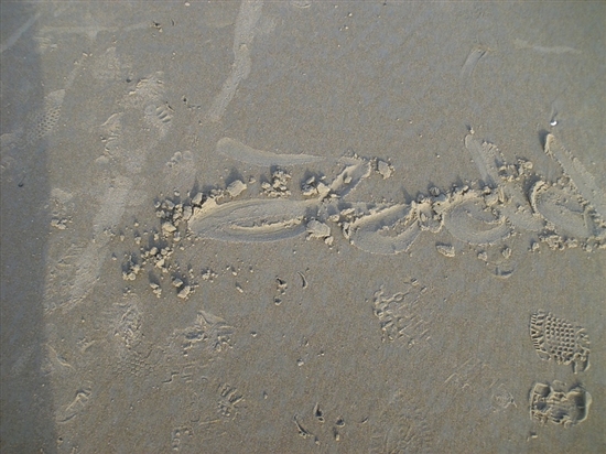 Todd drew his name in the sand with his shoe.